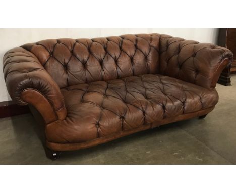 A Regency style brown leather Chesterfield settee 