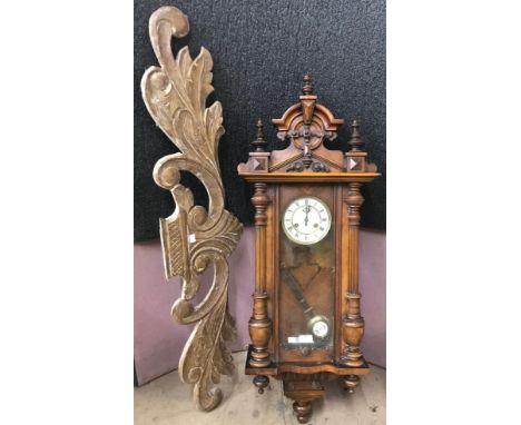 A carved walnut Vienna wall clock and a pelmet 
