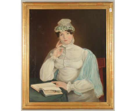 VICTORIAN SCHOOL. A portrait, half length, of a lady reading a book, oil on canvas. 30" x 24" (76 x 60cms), in a good gilt fr