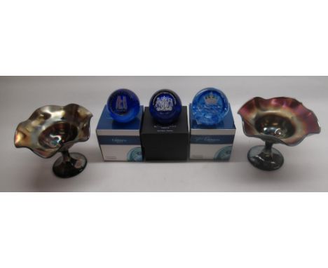 Three commemorative Caithness glass paperweights with boxes, and a pair of carnival glass pedestal bowls 