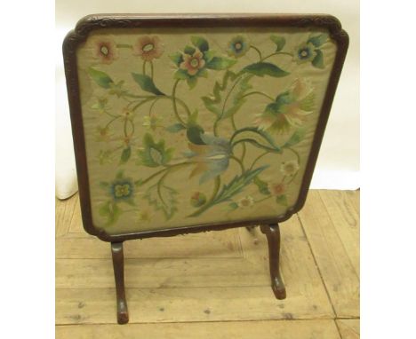 C20th mahogany framed fire screen table with inset silk work floral panel, on 4 splay legs 