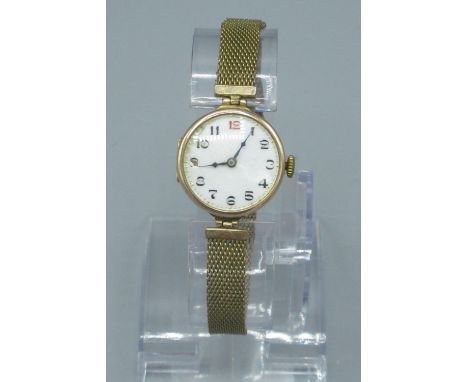 Swiss early C20th ladies 9ct gold cased wristwatch with enamelled dial(a/f) snap on bezel with hinged case back, hallmarked .