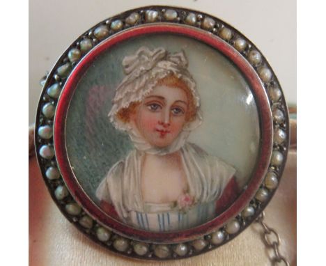 Late C18th yellow metal brooch set with portrait miniature of a young woman, with seed pearl surround 