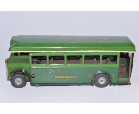 Vintage tinplate Tri-Ang Minic Greenline single deck clockwork bus model, tested and in fair working order and good external 
