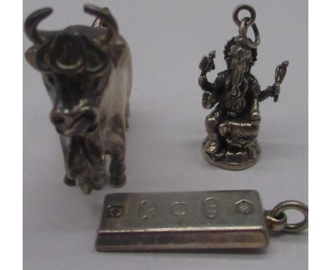 Sterling silver model of a bull (tail A/F) stamped Peru 925, a Ganesh pendant stamped 925 and a silver ingot pendant, gross 2