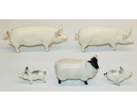 Beswick animal figures: Scottish black faced sheep model 1765, and four pigs, model numbers 1452A, 1453A, 833, 834 (5) 