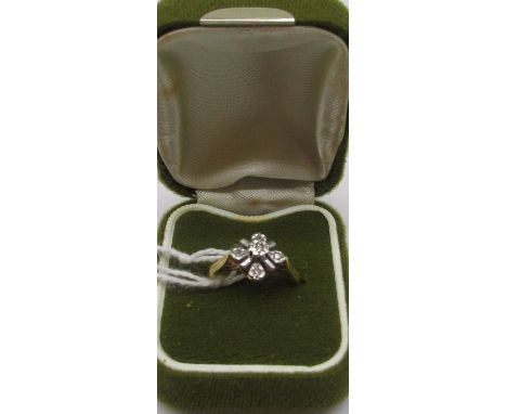 18ct yellow gold diamond cluster ring, the five brilliant cut diamonds in illusion settings, stamped 18, size M, 2.7g