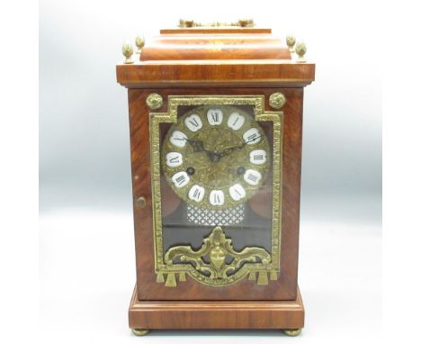 F. Mouthe c20th French Empire style mantle clock, with cast brass scroll handle, inlaid caddy top, flame finials and brass fr