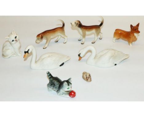 Beswick animal figures: two swans, cygnet, corgi, kitten, and three other ceramic figures (8) 