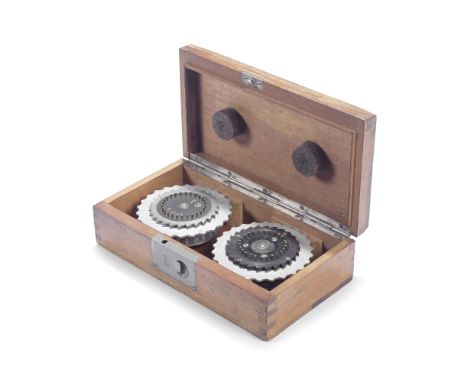 AN ENIGMA ROTOR BOX WITH TWO ROTORS, GERMAN, DATED 1936,Rotor serial numbers: III (A00413/43E), V (A1727)Rotor V (A1727) of e