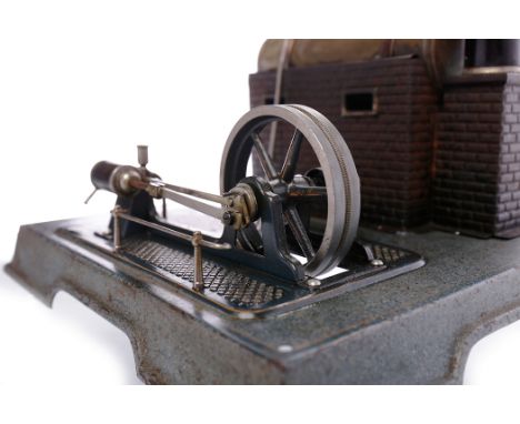 MARKLIN LIVE STEAM STATIONARY ENGINE MODELwith a horizontal brass boiler, mounted on a brick effect stand with chimney, conne