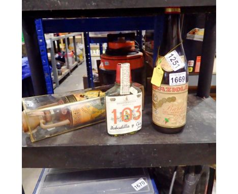 Three bottles of alcoholic beverages, including Brandy and red wine. Not available for in-house P&amp;P