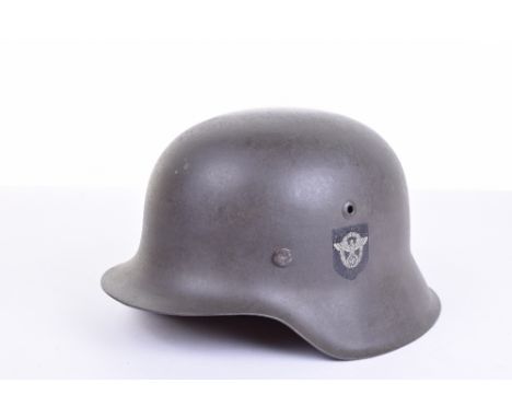 German Third Reich Police Steel Combat Helmet with Camouflaged Cover, M-42 pattern combat helmet with Police type decal. Comp