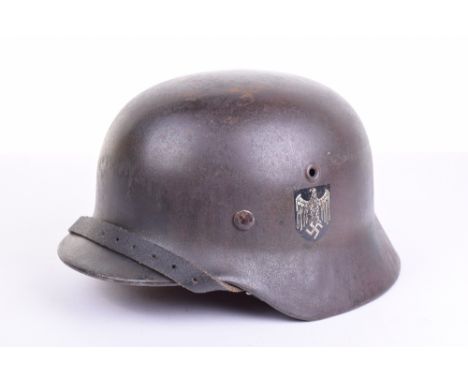 German Third Reich Double Decal Steel Combat Helmet, complete with German army decal and tri-colour decal. Helmet is complete