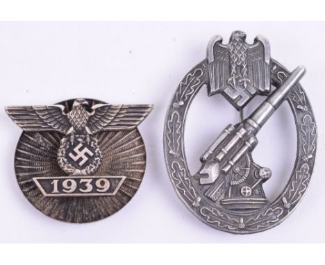 German Army Flak Badge with pin fitting and C E JUNCKER BERLIN SW to the reverse. Accompanied by a screw back bar to the Iron
