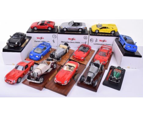 Quantity of 1:18 Scale  Burago and Miasto models, 8 x unboxed Burago (seven on wooden plinths) Jaguar E Type (missing one rea