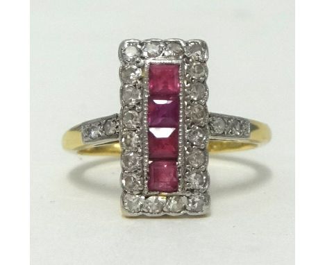 An 18ct gold and platinum ruby and diamond ring, having four central rubies within a border of round cut diamonds and further