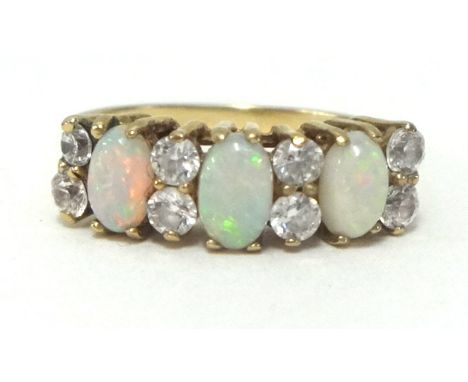 A 9ct opal and diamond ring, finger size K