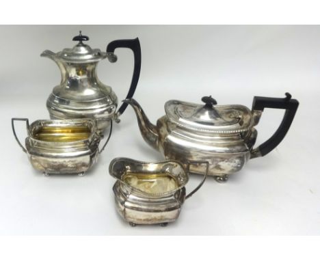 An Edwardian four piece silver tea service, approx 60oz (a set of three plus one).