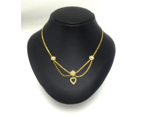 A pretty 15ct gold half pearl heart necklace.