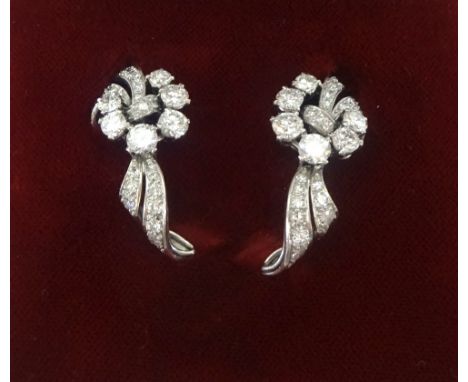 Garrard, London, a pretty pair of diamond set dress clips.