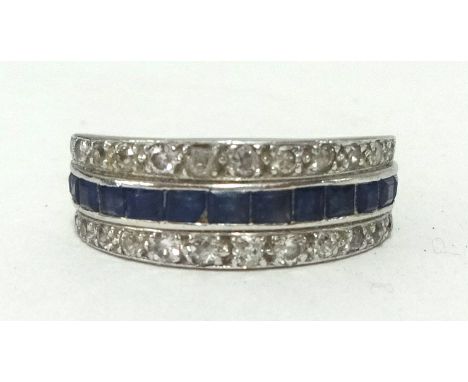 A diamond, sapphire and ruby band ring, ringer size O.