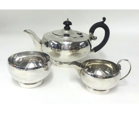 A Geo V three piece silver tea service, approx 21.60oz.