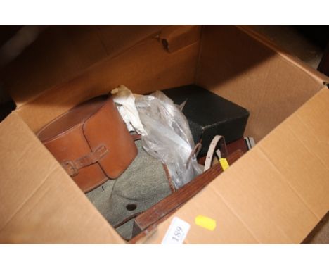 A box containing camera, shoe last etc.