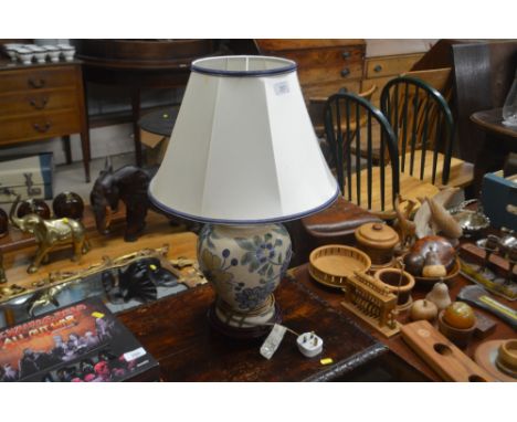 A floral decorated baluster table lamp and shade 