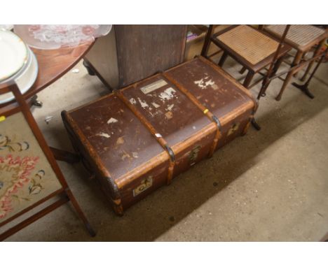 A wooden bound travelling trunk