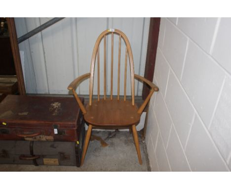 An Ercol elm stick back carver chair 