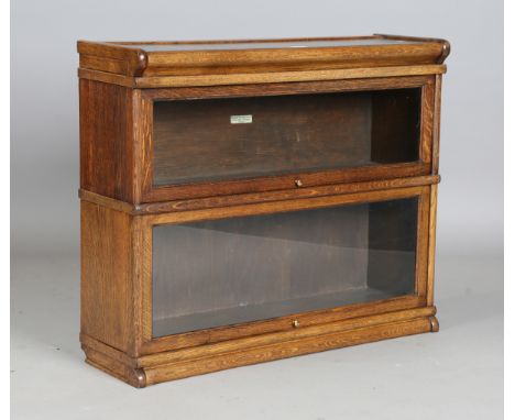 An early 20th century oak Globe Wernicke two-section glazed bookcase, height 76cm, width 82cm, depth 27cm (some alterations).