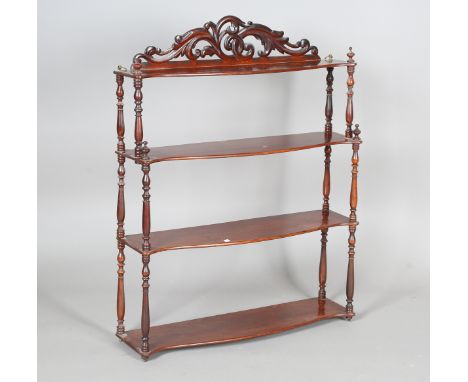 A Victorian mahogany graduated four-tier wall shelf with carved foliate frieze, height 83cm, width 66cm, depth 18cm.Buyer’s P