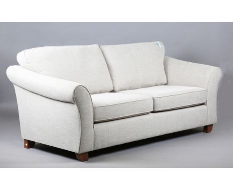 A modern Marks &amp; Spencer three seat sofa, upholstered in oatmeal fabric, height 80cm, width 225cm, depth 100cm.Buyer’s Pr