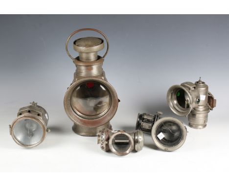 An early 20th century Lucas 'Petroleum Motor-Lamp', height 34cm, a Miller &amp; Co 'Talolite' lamp and three other lamps.Buye