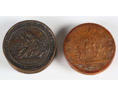 An early 19th century pressed wood snuff box, the lid decorated with a Napoleonic military scene, diameter 8cm, together with