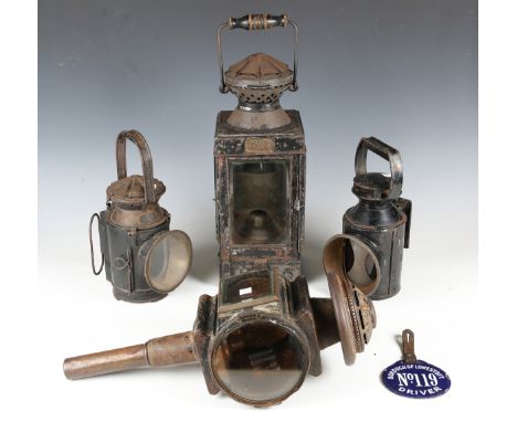 A black painted tin railway lamp by J.C &amp; W. Lord of Birmingham, height 50cm, two British Railway lamps, a coaching lamp 