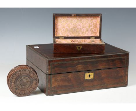 An early Victorian rosewood and brass inlaid travelling vanity case, the interior partially fitted with glass jars, width 33c