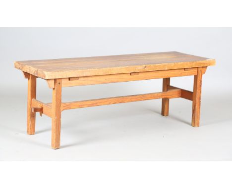 A 20th century pine bench, the four-piece top on block legs, height 44cm, width 120cm, depth 40cm.Buyer’s Premium 29.4% (incl