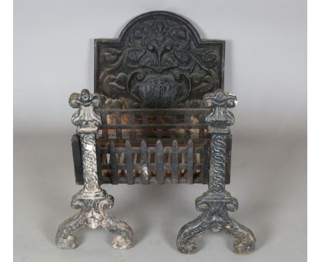 A pair of early 20th century cast iron fire dogs, together with a fire grate and an arched fire back, height 52cm, width 54cm