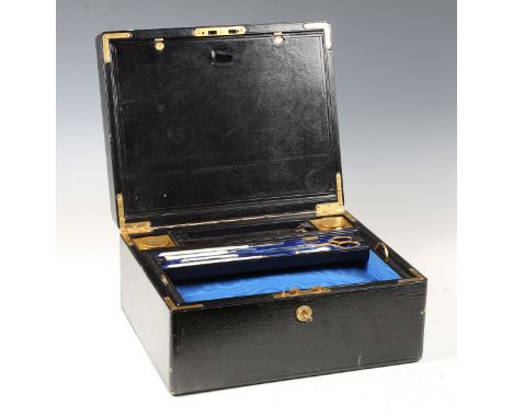 A late Victorian black Morocco leather writing slope with gilded metal mounts, the silk-lined interior fitted with ivory hand