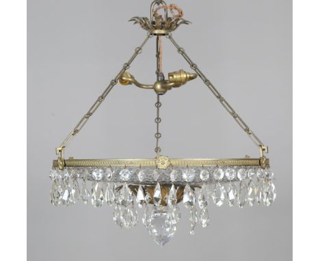 An Edwardian gilt brass and cut glass circular ceiling light, the guilloche decorated circlet supporting a cut glass shade hu