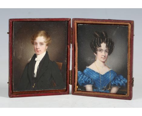 A pair of 19th century ivory portrait miniatures on ivory, depicting a seated lady and gentleman, each 8cm x 6cm, both cased 