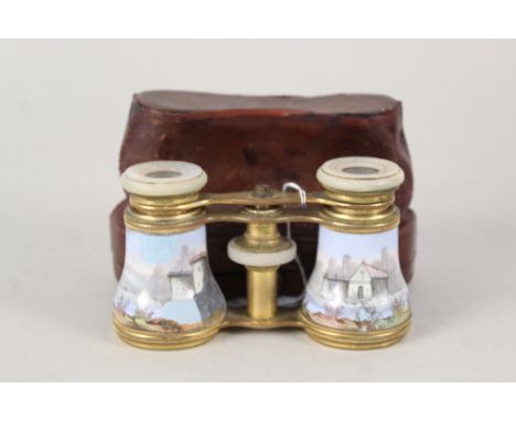A cased pair of 19th Century brass and mother of pearl opera glasses with painted enamel figure and pastoral scene barrels (l