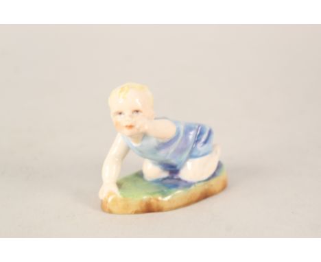 A Royal Worcester figure of a crawling child by F G Doughty
