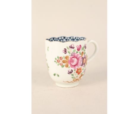 A Worcester cup with floral decoration, fluted top rim and blue internal border, crescent mark