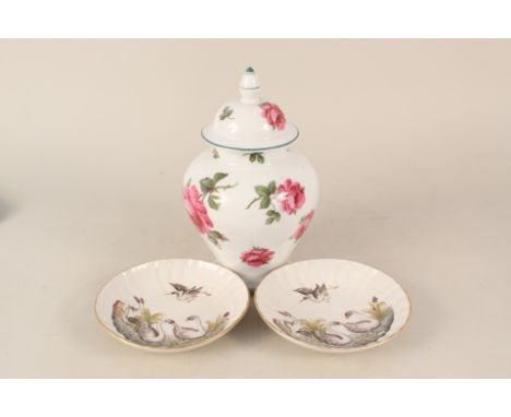 A continental porcelain rose decorated lidded jar plus two 19th Century Italian saucers with relief bird decoration