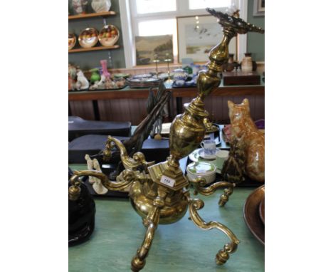 A heavy six branch brass chandelier, 26 1/2" high and 21" wide