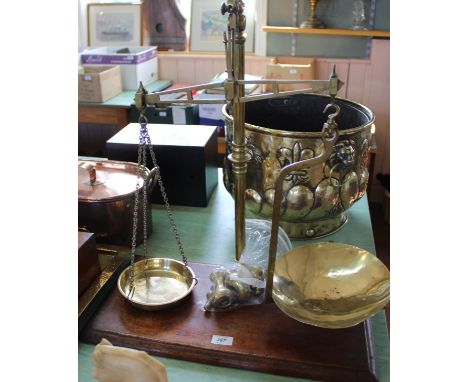 A pair of 19th Century brass shop balance scales to 4lb by Winsbury &amp; Son, London mounted on an oak base together with a 