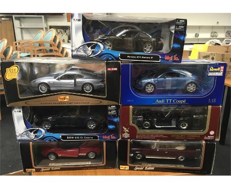 Seven 1/18 scale Maisto and other diecast sports cars, includes Road Legends Shelby Cobra. Appear E-M and boxed. 